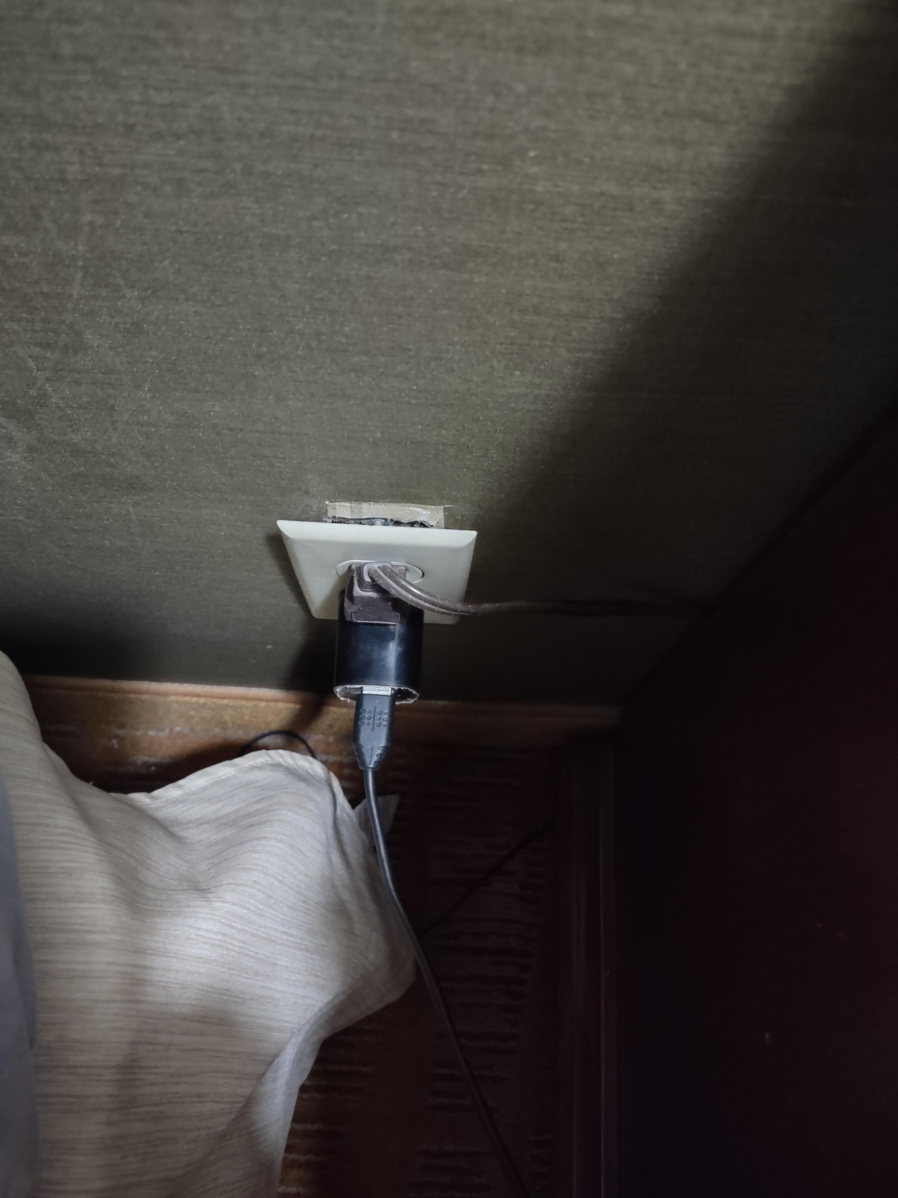 Electrical outlet pulled out of the wall.