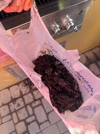 Half of grocery bag of stuff we cleaned and scraped off of grill.