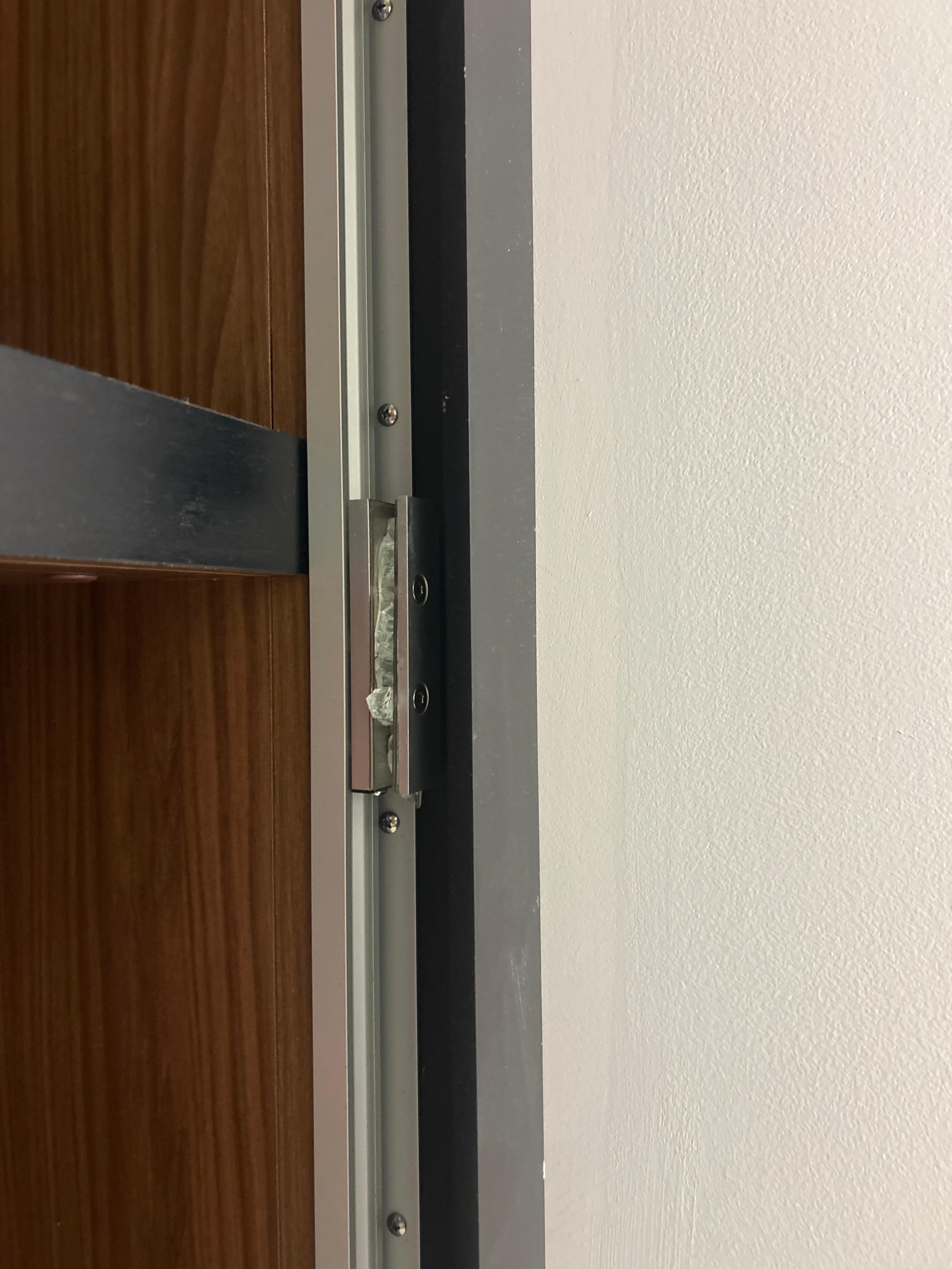 This is the track that held a mirror or glass door which is broken but still has loose shared falling from it and are on the top shelves of the closet 