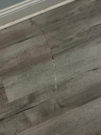 Scratch on floor from door.