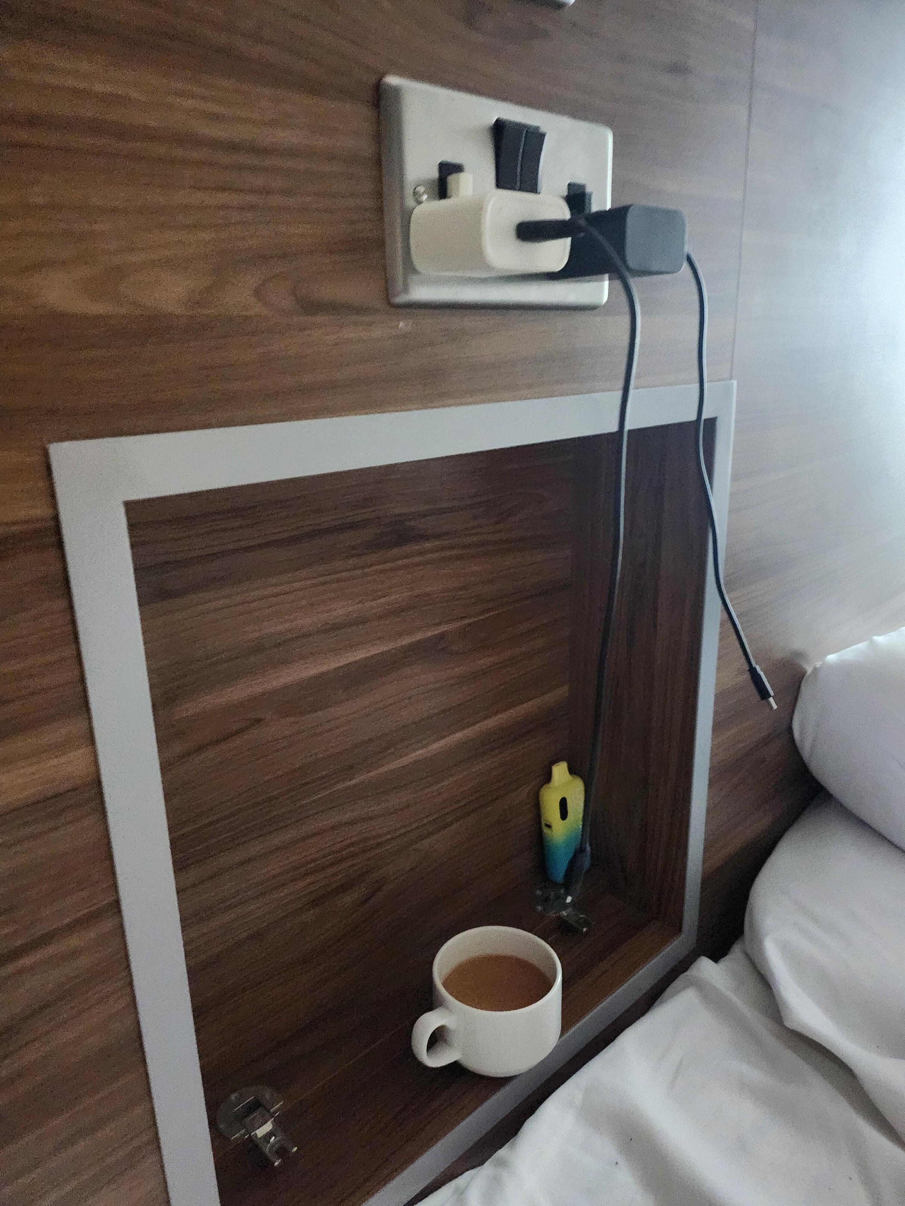 Cubby between the beds, beds have PERFECT charging stations, cubby works as a side table!