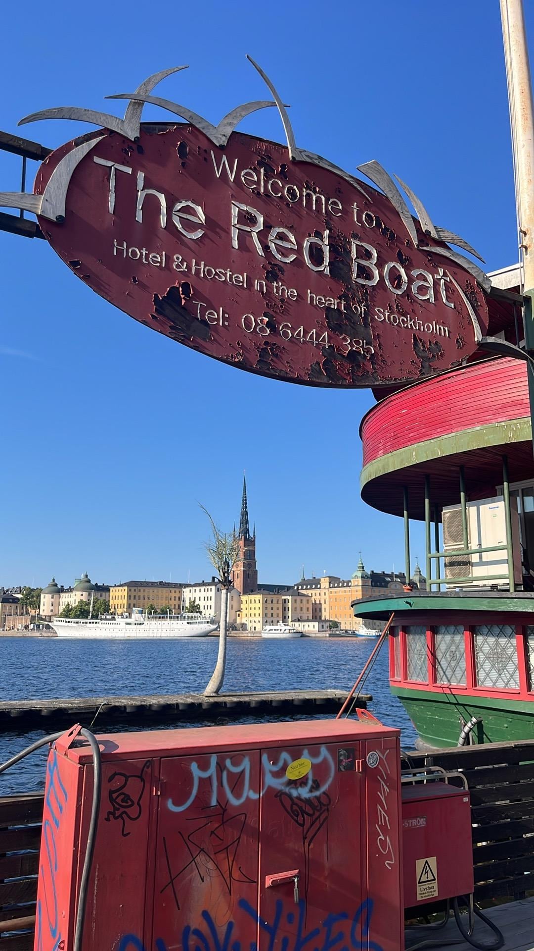 Sign for the boat and the kind of view you can glimpse if you have a room on the side of the boat away from shore.