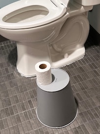 Garbage can modified to hold toilet paper