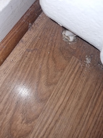 Dirty floor by radiator