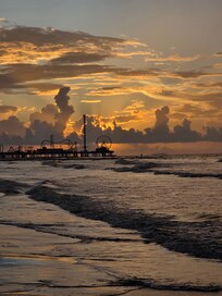 Morning walk at sunrise looking at the pier