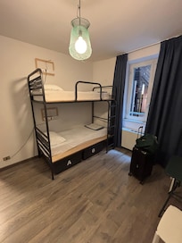 Six bed room, partly divided into two sections.