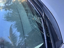 Broken windshield by coconut