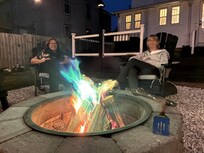 Enjoying the evening by sitting by the fire pit