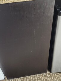 Something all over the cabinet looked like maybe a drink