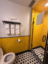 Bathroom was cute with the yellow tile.