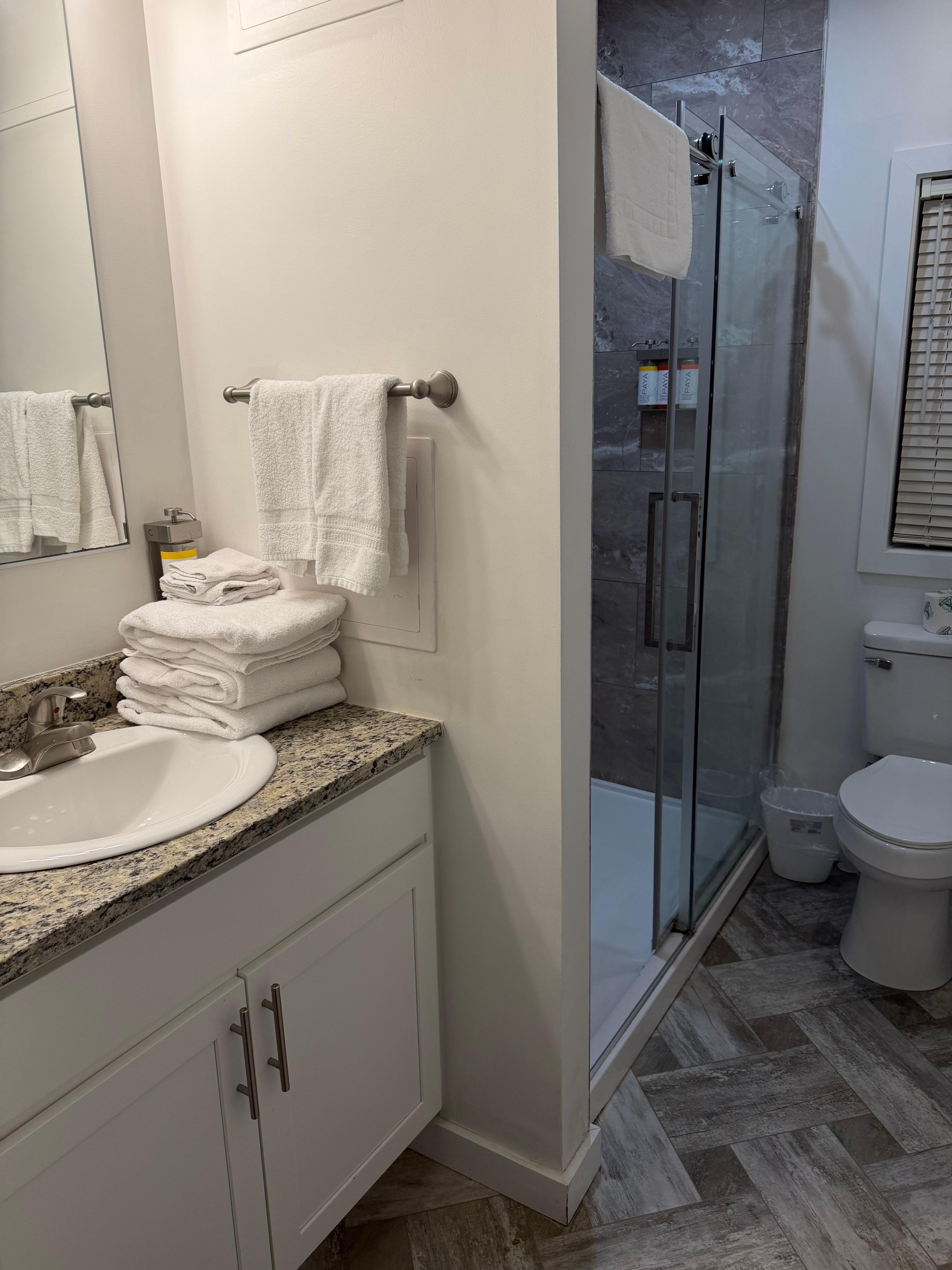 Clean bathroom with walk-in shower