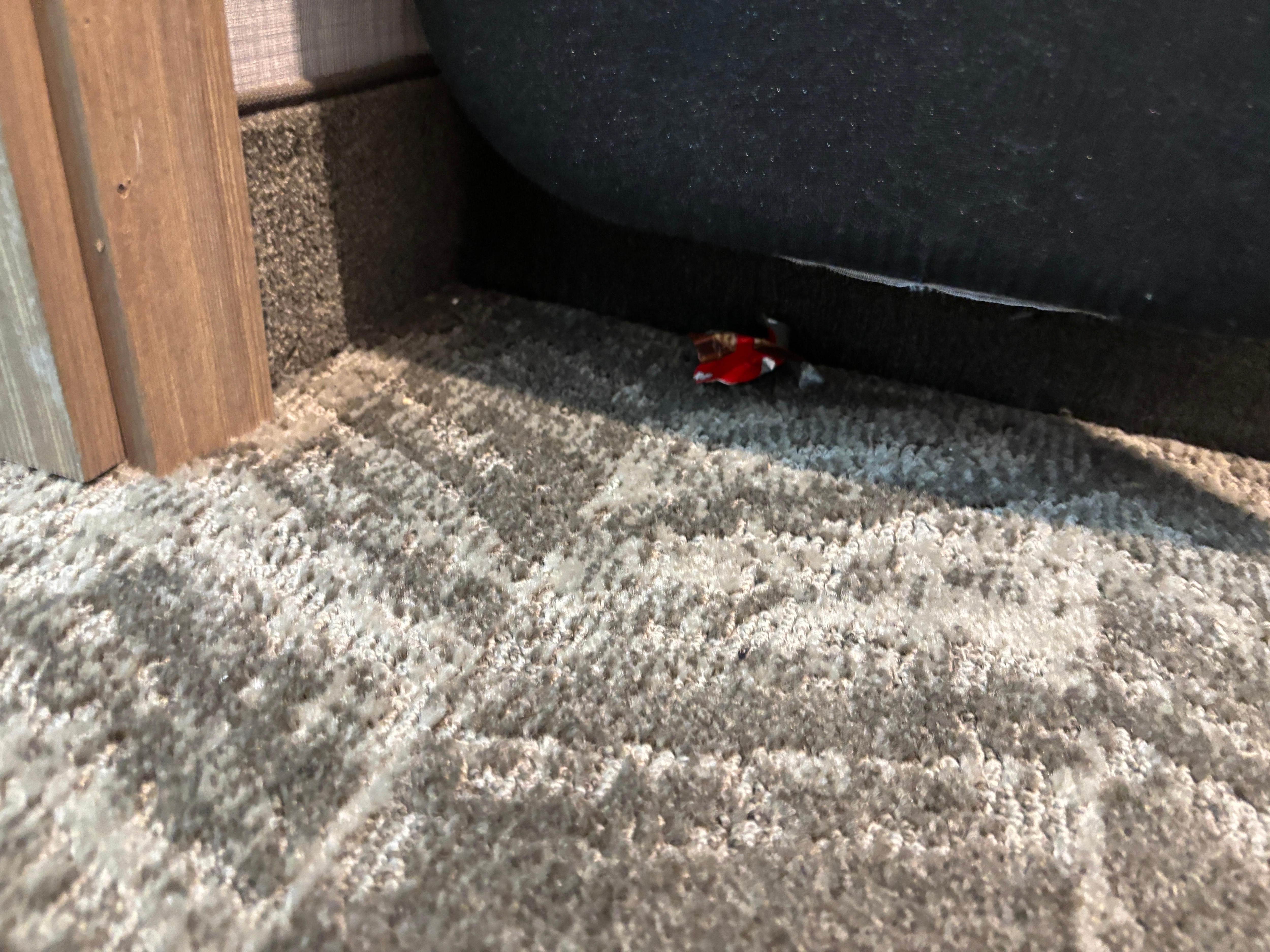 Dirty candy wrapper in closet. 