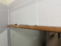 Exposed wires and dirt/dust in bathroom