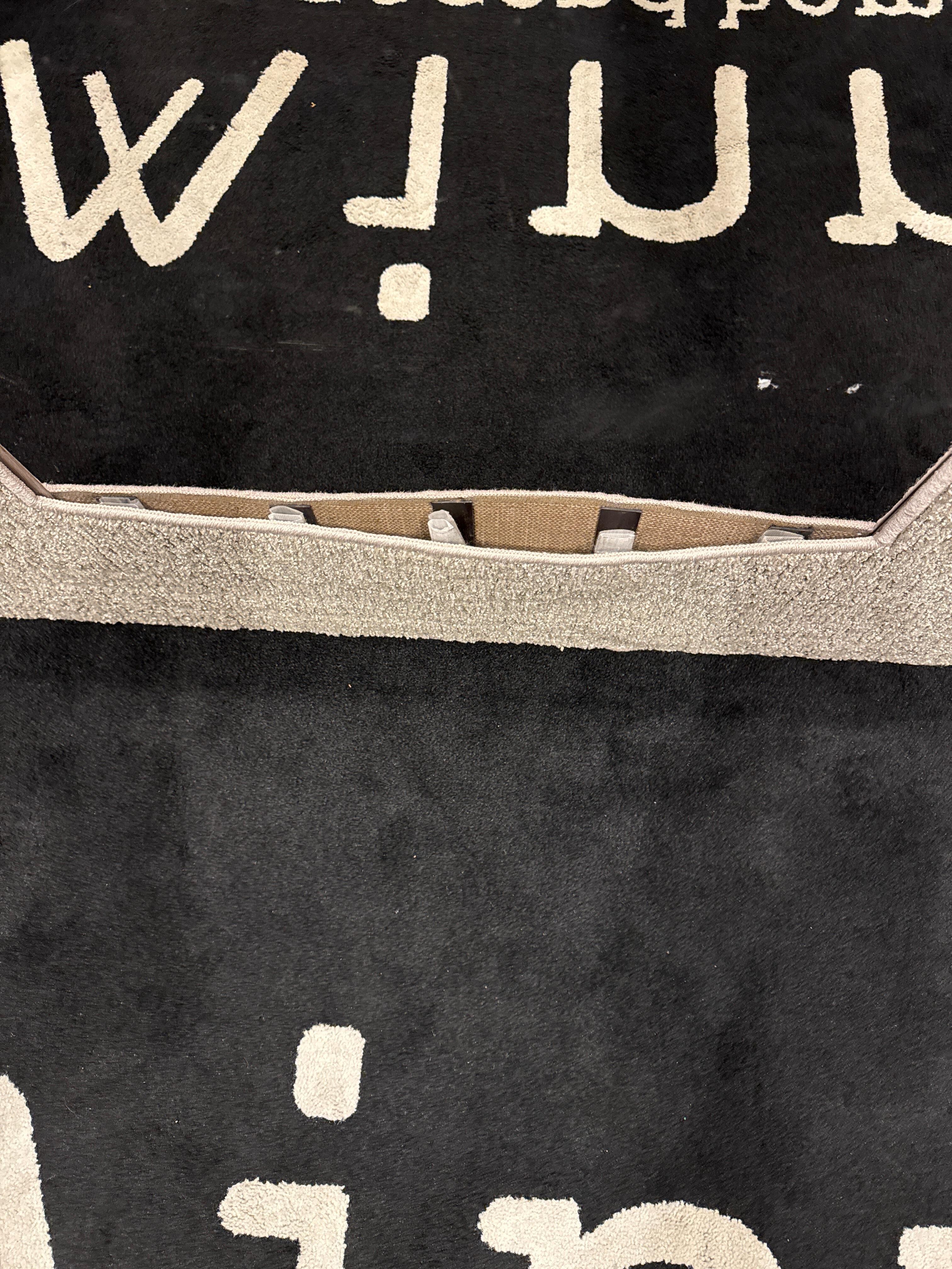 Wall carpet in elevator coming undone