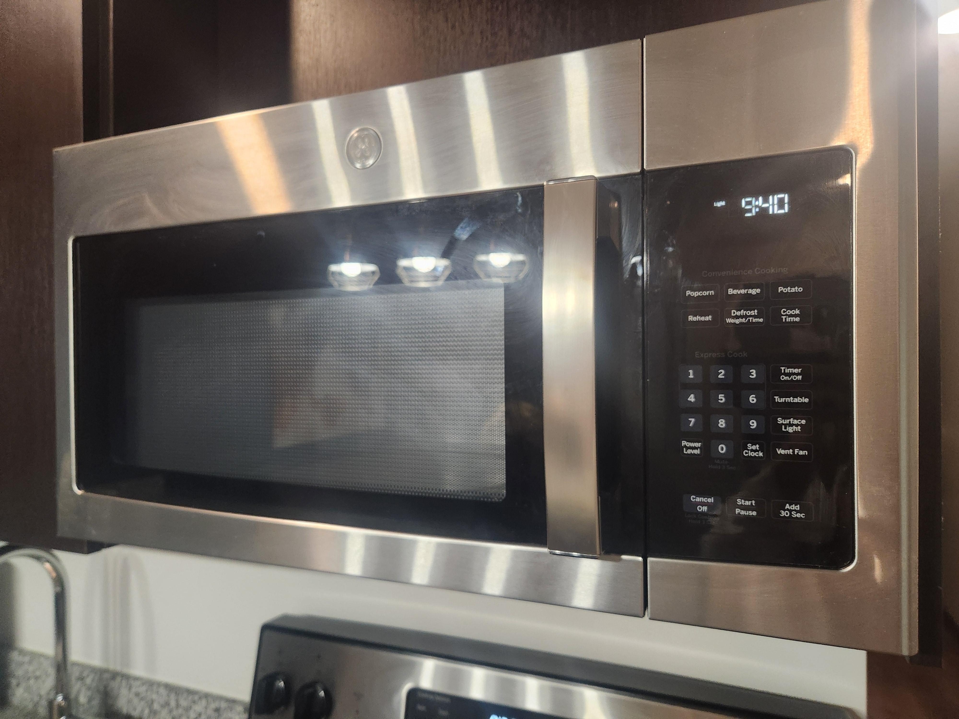 Finger and grease on microwave 