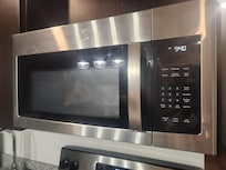 Finger and grease on microwave