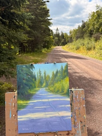 Beautiful sun-dappled road for walking or paintinf