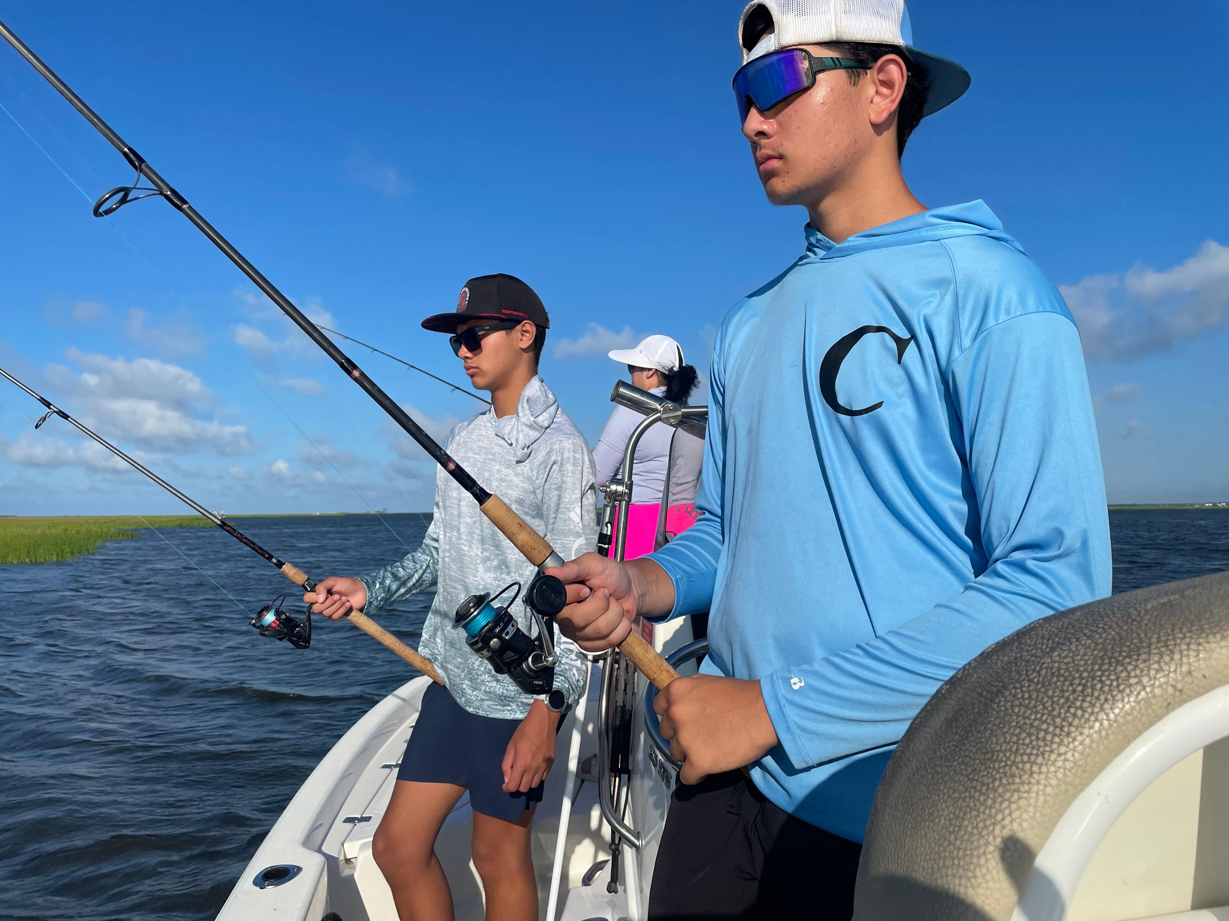 Boys caught lots of fish. 