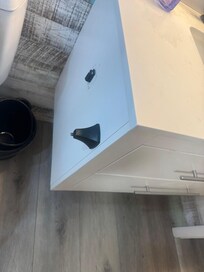 Broken toilet paper holder.