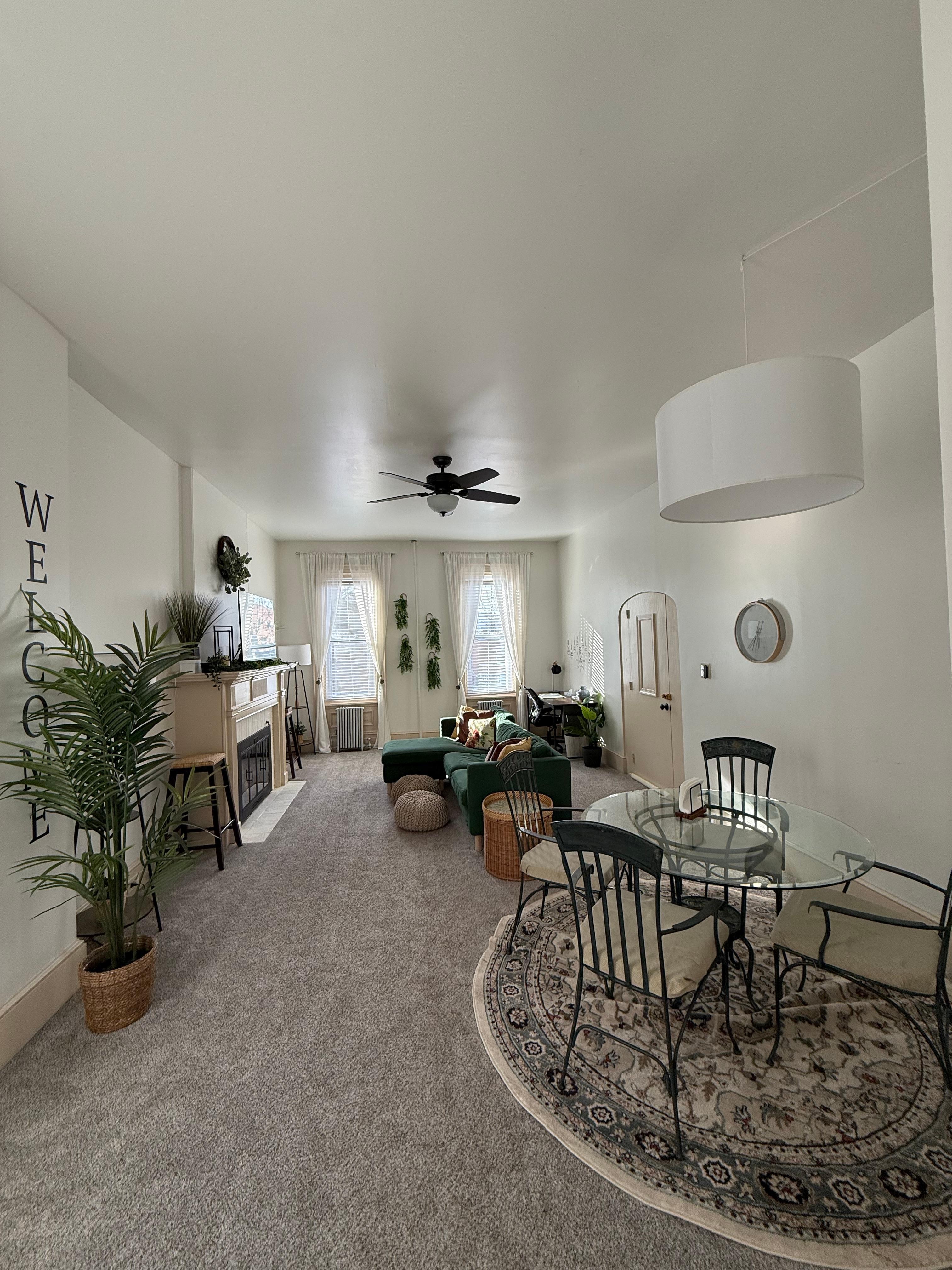 Living room, dining area, and desk/office space