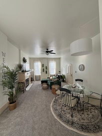 Living room, dining area, and desk/office space