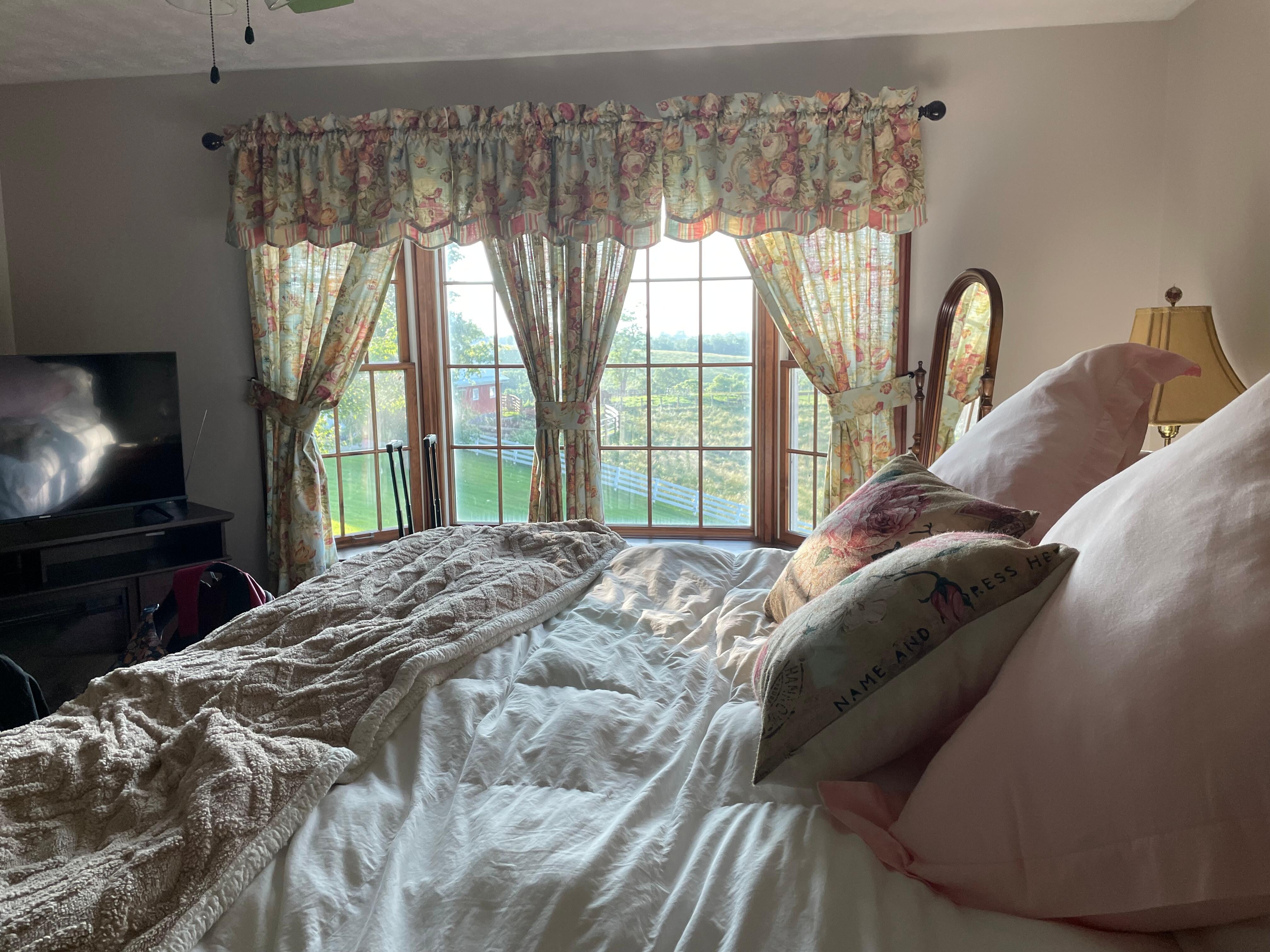 Master bedroom looks out to the cattle barn. 