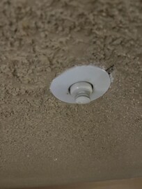 Broken off light bulb and dirty filthy ceiling