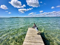End of the dock with beautiful Higgins lake water