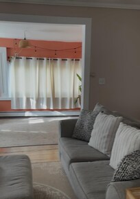 Living room with chimney and huge TV
