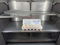 The carton of broken, bad eggs we found in the fridge. Owner stated the cleaning crew forgot to throw it away.