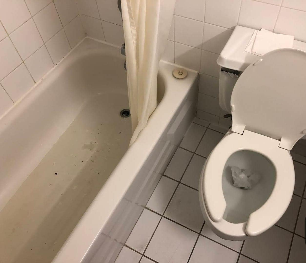 Water and dirt in the bath tub