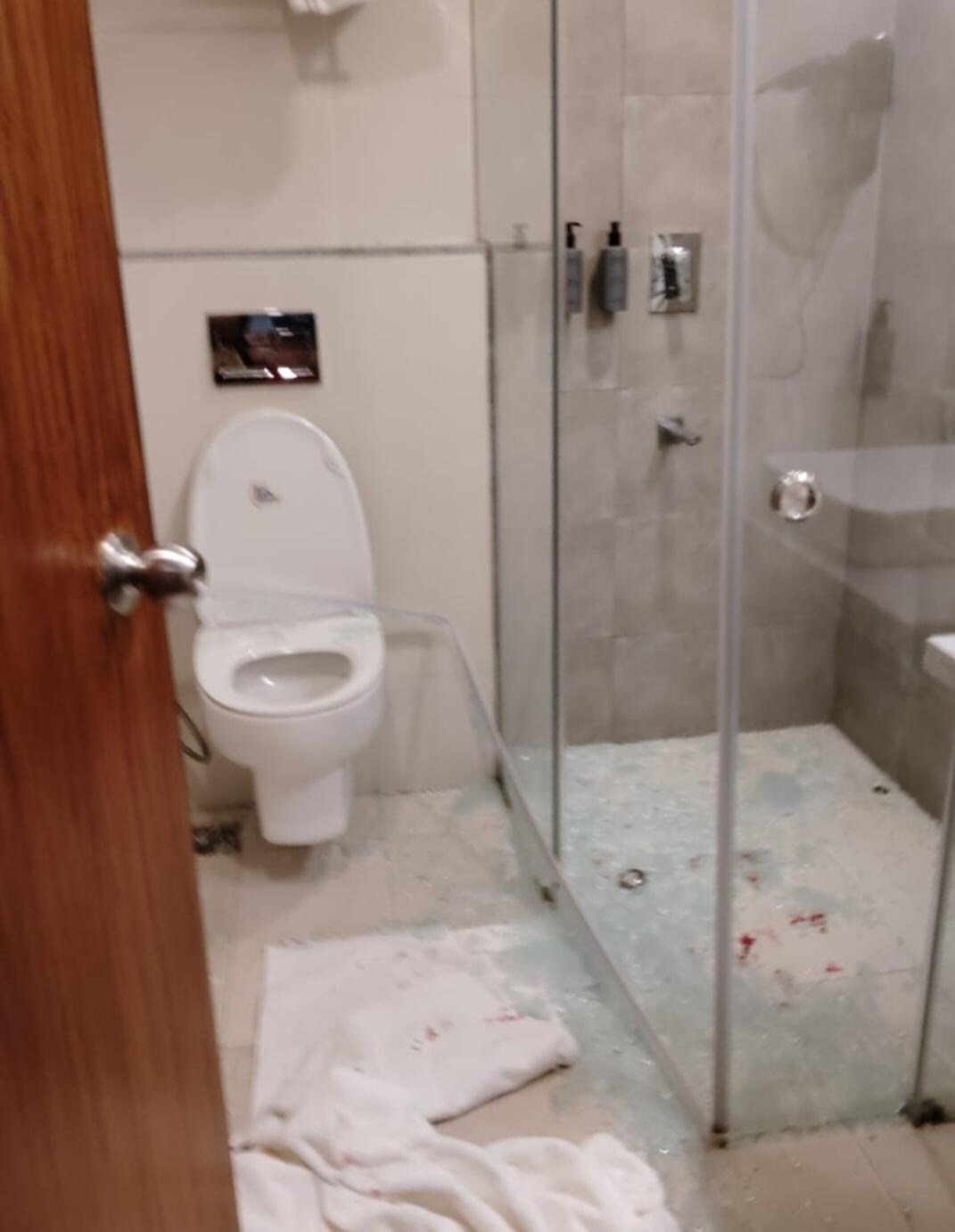 Bathroom glass shower door shattered on me.
