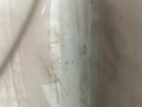 Shaved hairs by sink