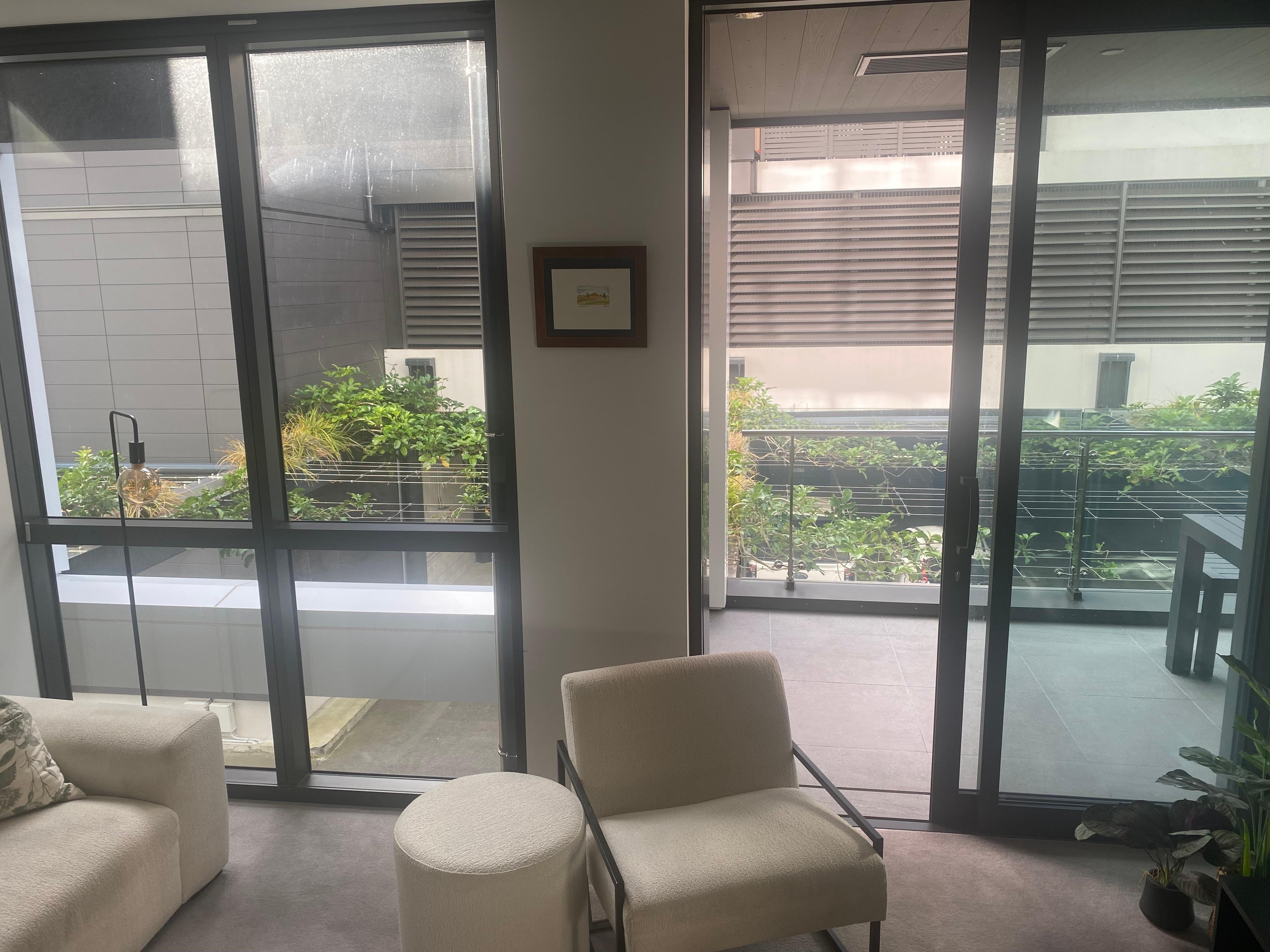 Level 1: View from lounge directly into a carpark - no curtains or privacy