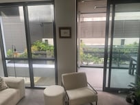 Level 1: View from lounge directly into a carpark - no curtains or privacy