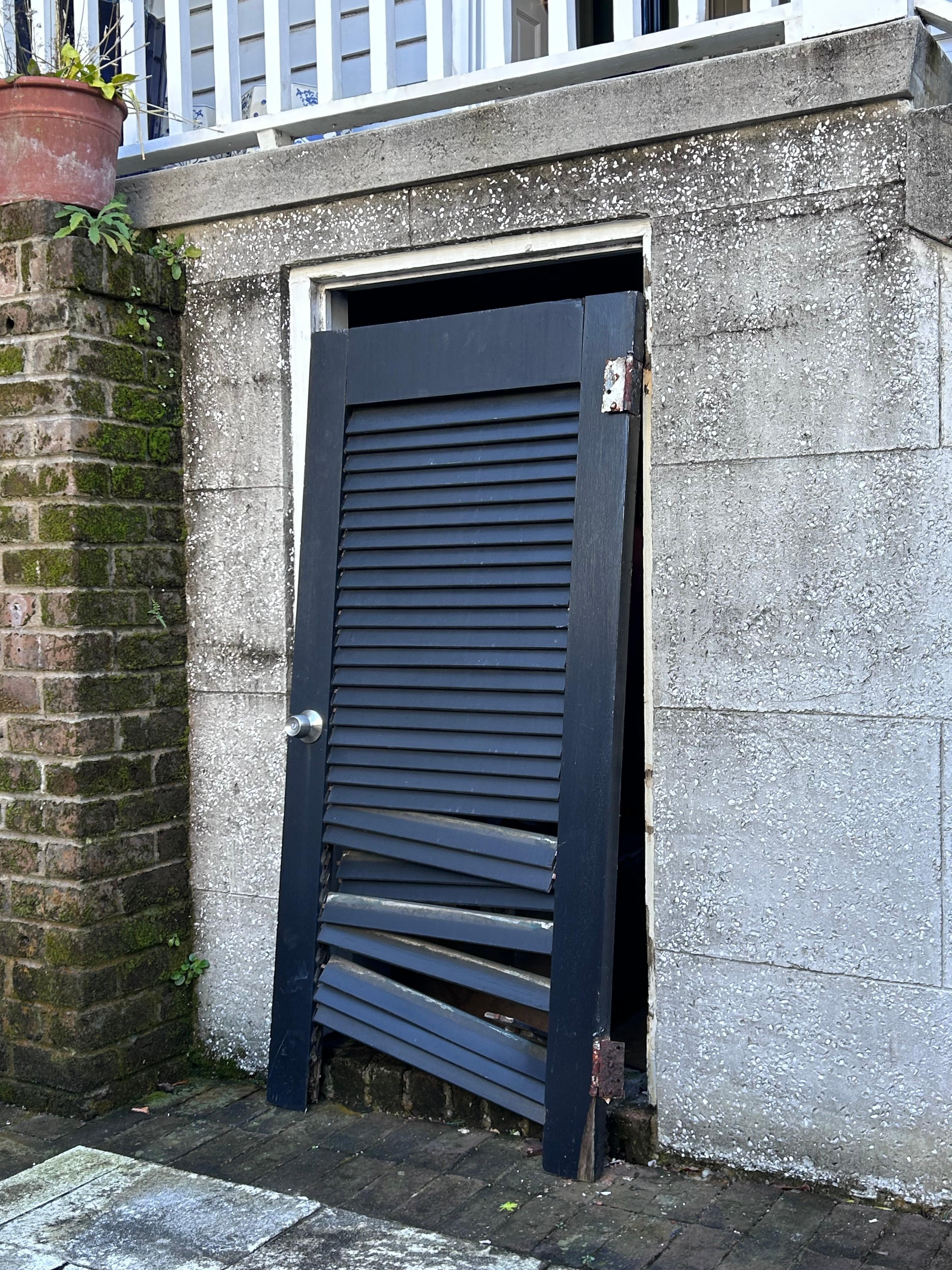 I wish I had taken more pics, but here is a pic of the door hanging off the wall in the patio.  