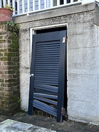 I wish I had taken more pics, but here is a pic of the door hanging off the wall in the patio.