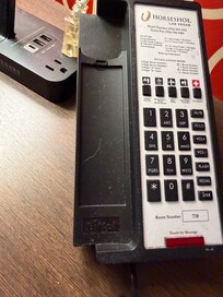 Nasty white hair and dust on telephone. Gross.