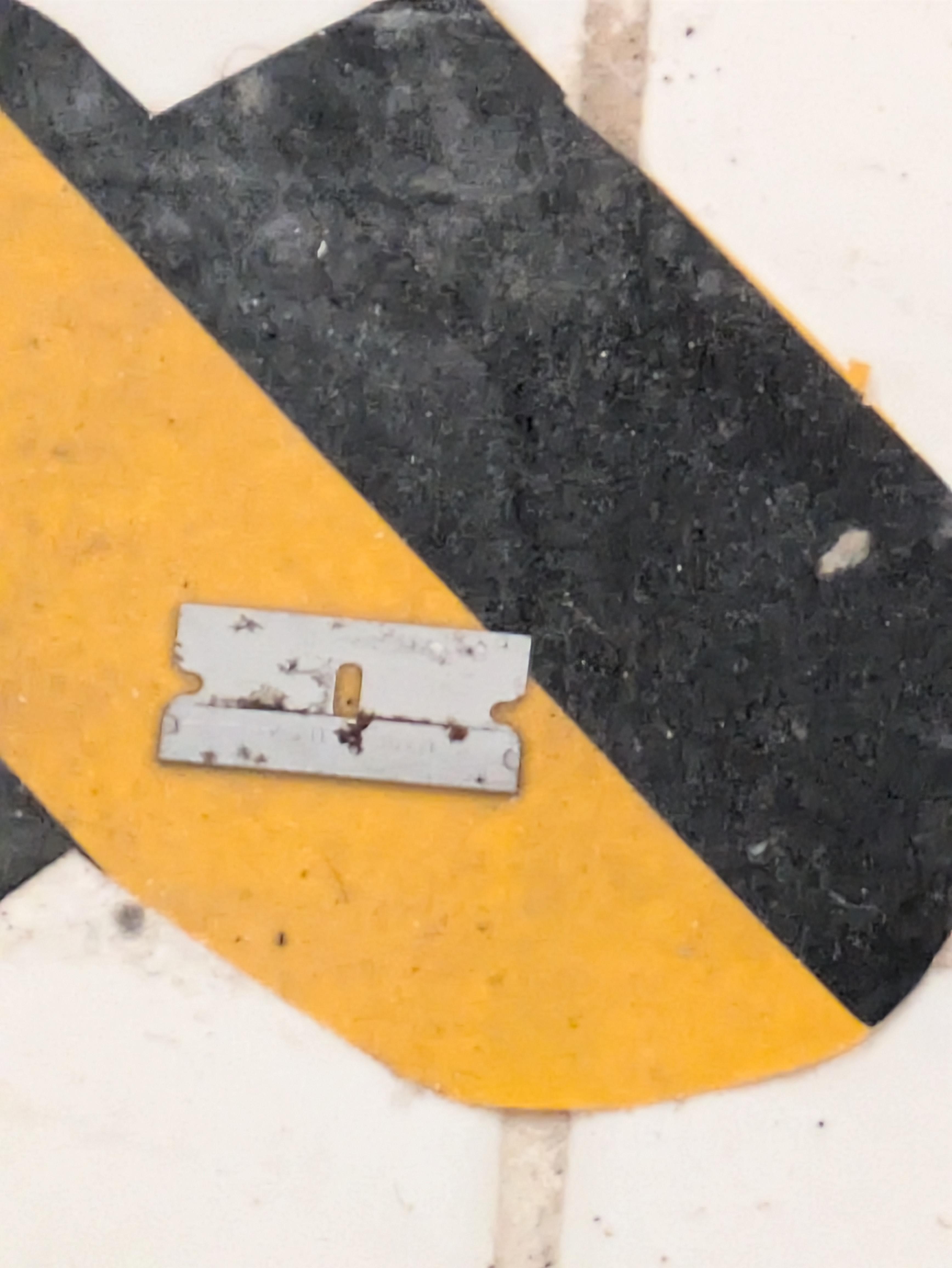 Razor blade on shower floor