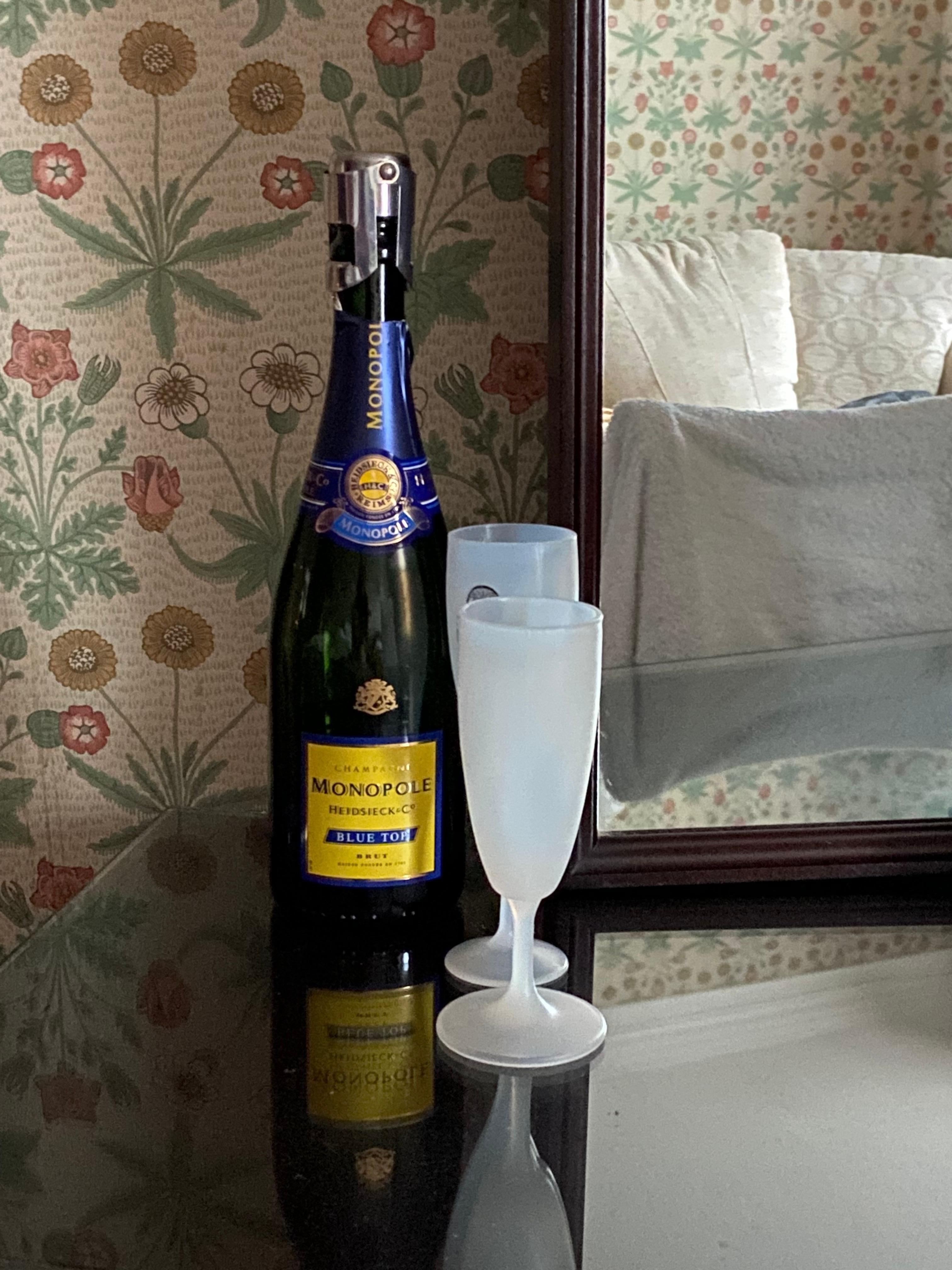 Traditional decor (mahogany furniture and William Morris type wallpaper . (Champagne was ours)