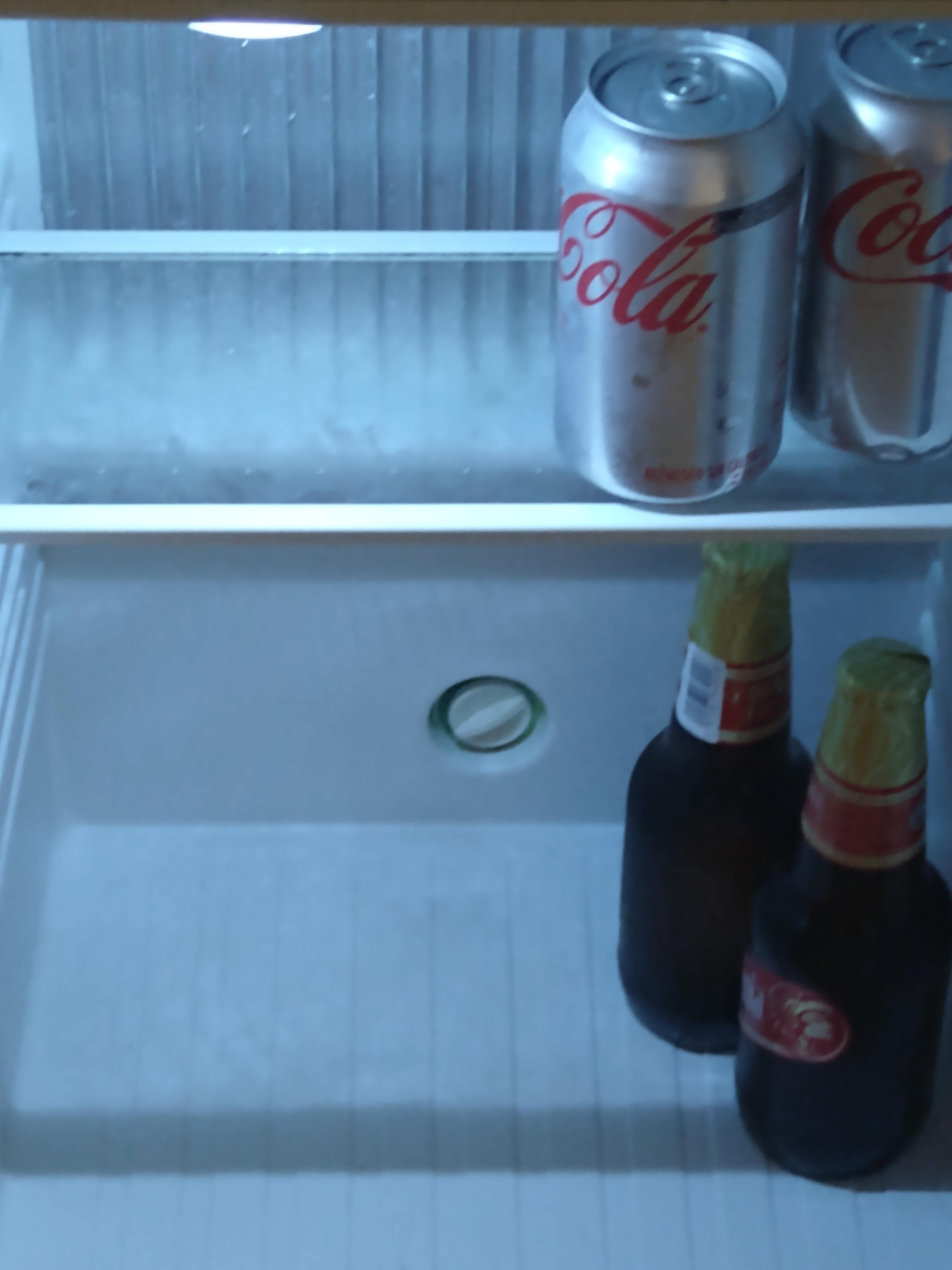 Empty mini bar in our new room comes with 2 water,2, beer, 2 sodas Coke and diet.