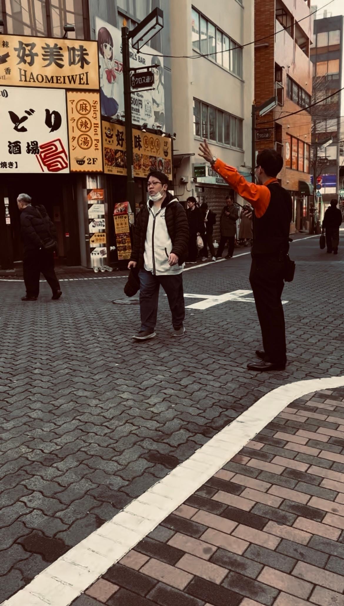 It’s busy outside each morning with people lined up for pachinko gaming nearby 