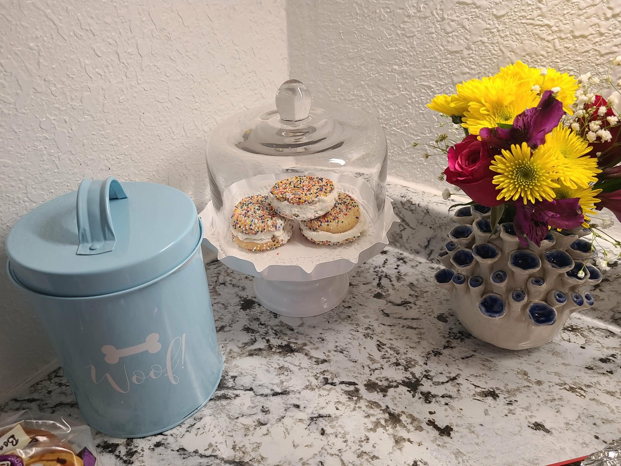 Snacks and fresh flowers for dogs and guests