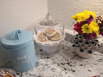 Snacks and fresh flowers for dogs and guests