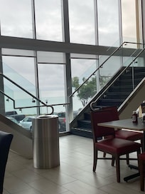 Upper seating for breakfast with bay and airport view.