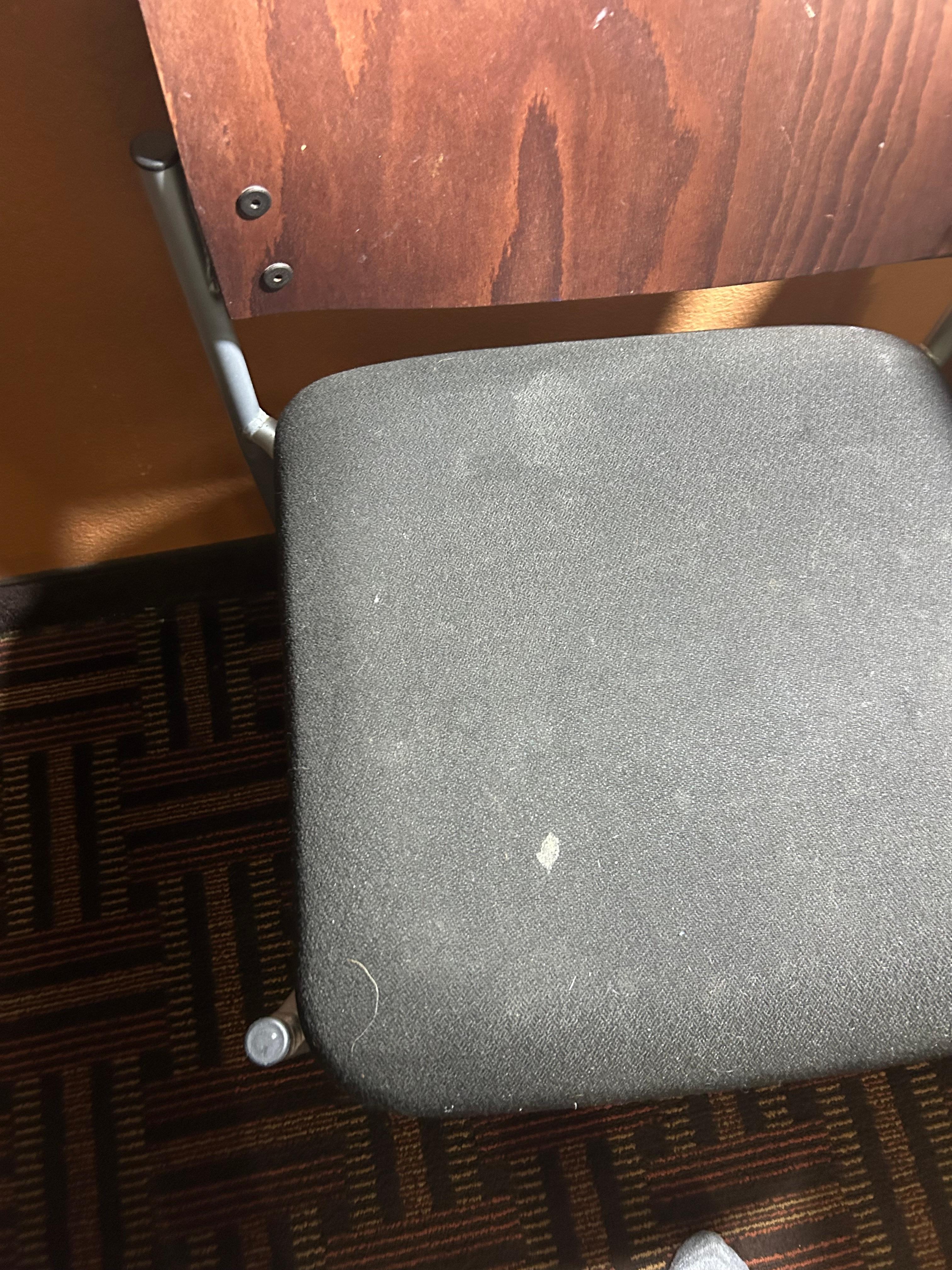 Spots of gunk on the chair. Clean it!