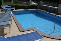 Lovely pool and sunbeds, although this photo does not show the artificial grass to the left hand side.