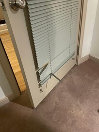 Door blinds broken and a hazard.