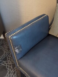A worn out chair in our $400 per night suite