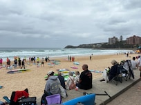 Kids learning to surf a five minute walk from our rental.